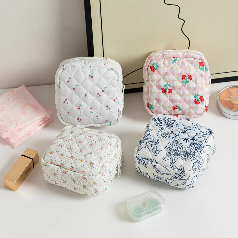 Cute Change women's polyester key storage bag in a floral pattern with sewing thread detail.