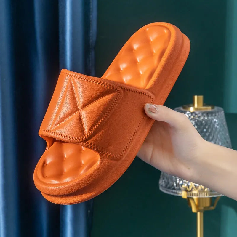 Pair of thick-sole non-slip EVA bathroom slippers shown in a choice of colours on a bathroom floor.