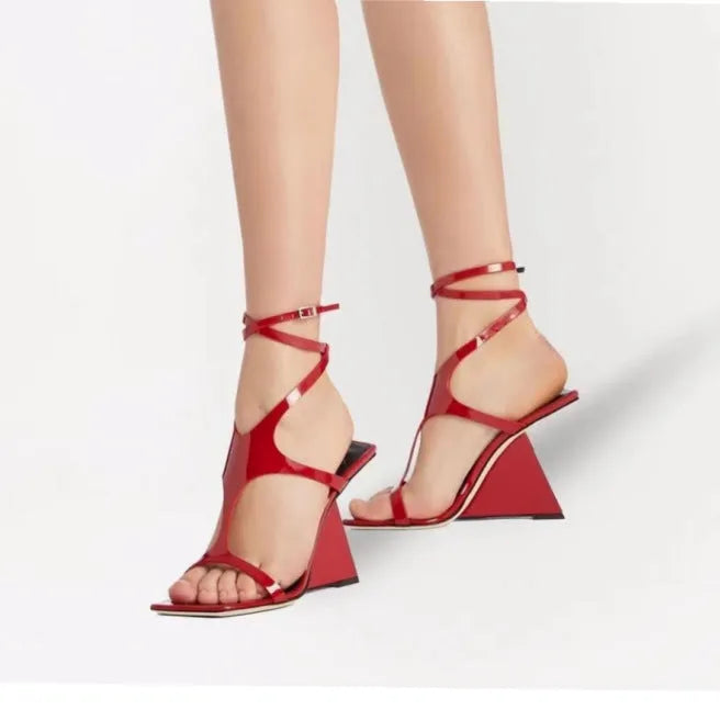 Black women's strappy high heel sandals with a square toe and ankle buckle on a 9.5cm rubber heel.