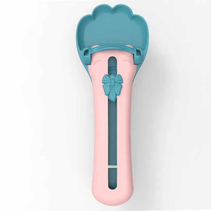 Green and pink pet food squeezer scoop for dispensing liquid food and treats