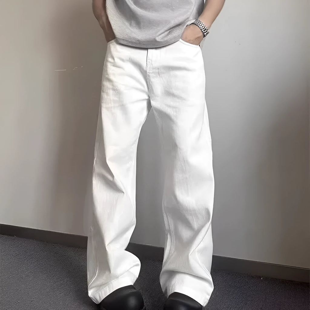 A pair of men's straight-leg white jeans with a mid-rise waist and zipper fly on a plain background.