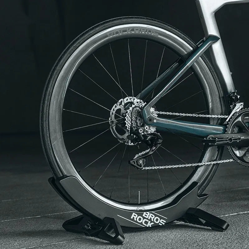 Black and green ABS plastic bicycle parking rack holder for road and mountain bike storage