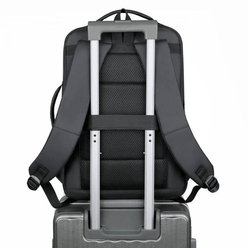 Black waterproof Oxford cloth business backpack with curved shoulder strap showing laptop compartment