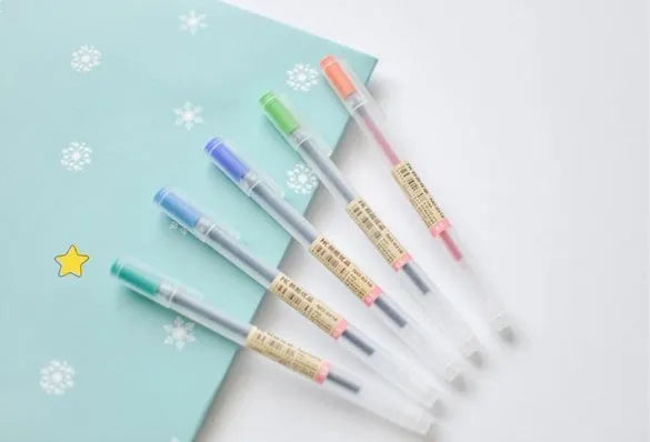 Muji 12 Piece 0.5mm fine nib gel pen set with aqueous ink shown in packaging.