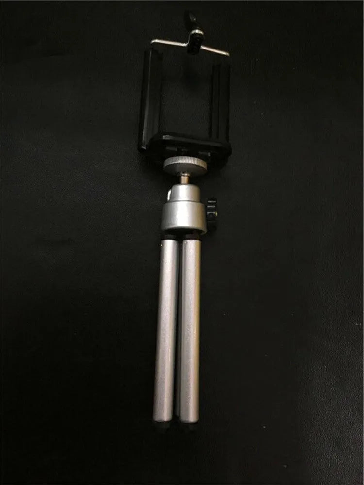 Two-section adjustable desktop phone holder in black and silver colour options on a desk