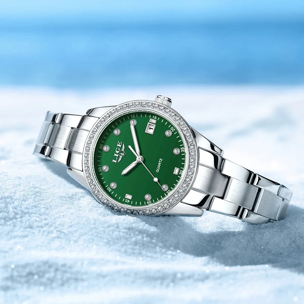 Silver fashion quartz watch with diamond-encrusted dial, stainless steel case, and luminous hands