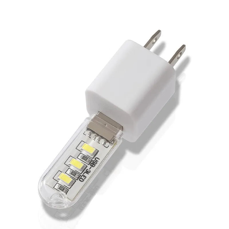 LED baby night light with USB cable showing white and warm light options