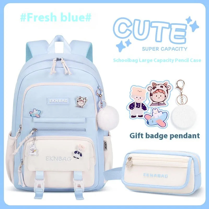 Pink waterproof school backpack for girls with curved straps, shown with matching pencil case and bag.