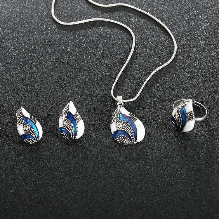 Water drop jewelry set including necklace, earrings and ring in gold or silver zinc alloy finish.