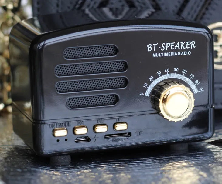 Vintage wood grain Bluetooth speaker in black, pink, and wood grain colours showing compact 93mm design