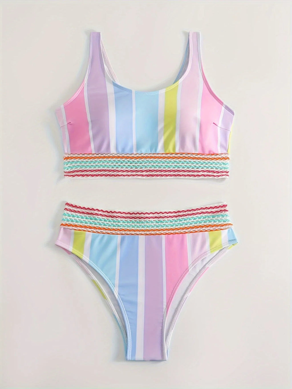 Women's striped two-piece bikini set for swimming and sports on a neutral background.