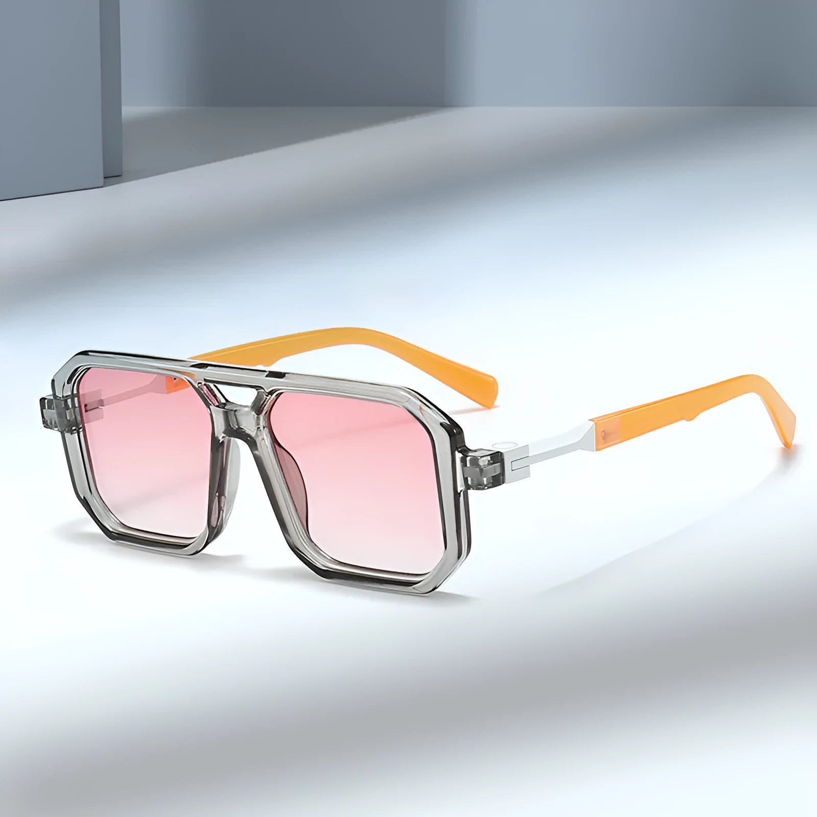 Retro double beam pilot sunglasses showing front design and metal spring hinge, in a black frame with gray lenses.
