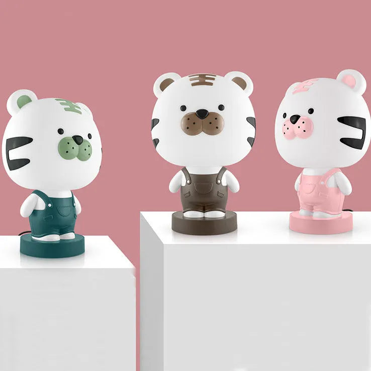 Cartoon animal table lamp with LED lighting and plastic shade in random bear, cattle, rabbit, or tiger designs