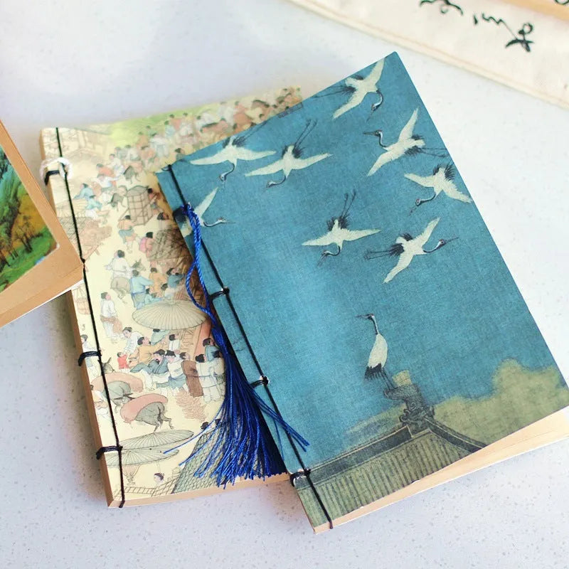 A5 antique art notebook with wire binding, decorative tassels, and traditional Chinese painting cover design