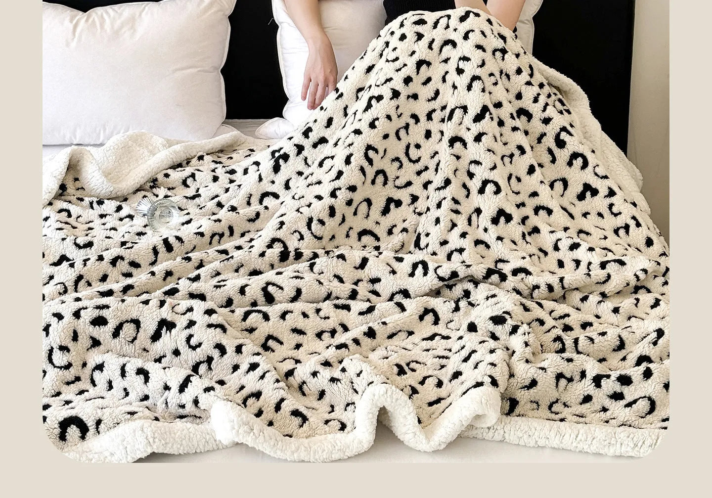 Double-layer cationic leopard jacquard taffeta blanket showing animal print pattern detail