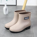 Women's mid-calf PVC rain boots in black colour with low heel
