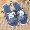 Blue women's flat canvas roman slippers with cloth lining and a rubber sole.