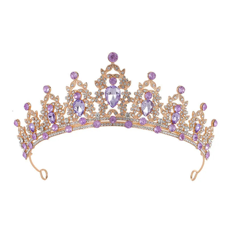 Baroque-style bride crown headdress made of alloy with rhinestone decoration in silver and gold colour options.