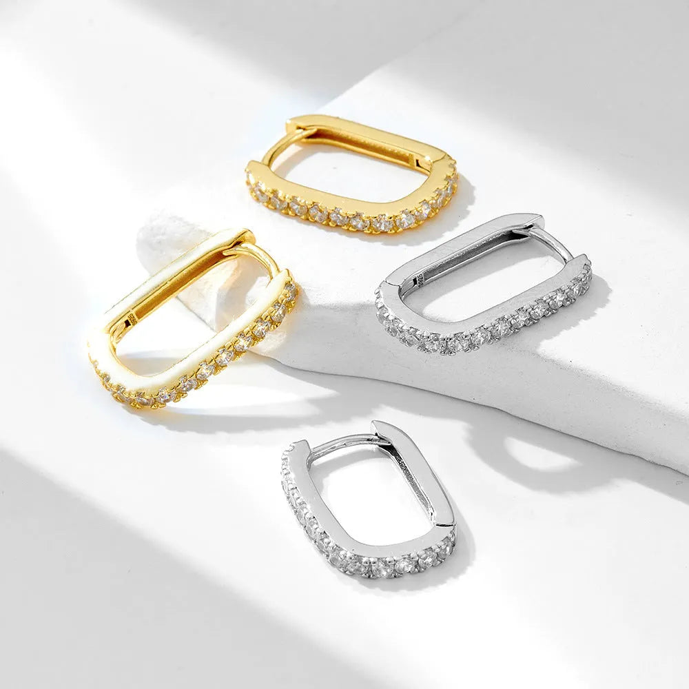 S925 sterling silver oval zircon ear clips with geometric design and diamond cut treatment