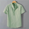 Men's beige slub linen casual shirt with stand collar and short sleeves on a hanger.