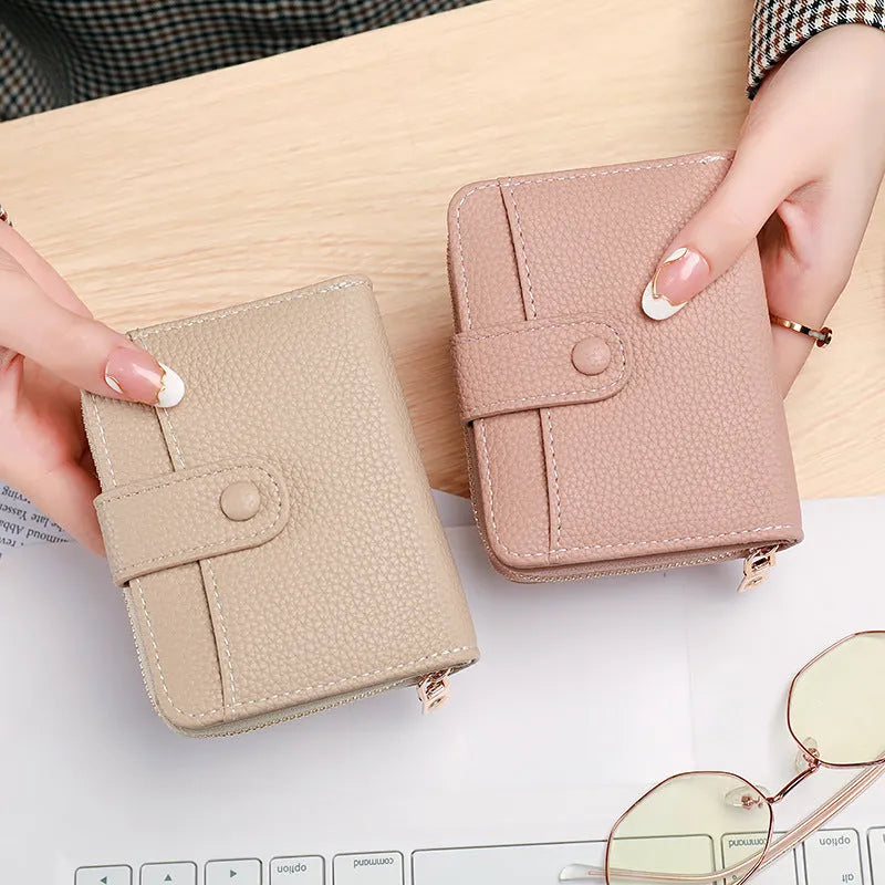 Ladies short wallet with lychee pattern in two-fold design showing four colour options