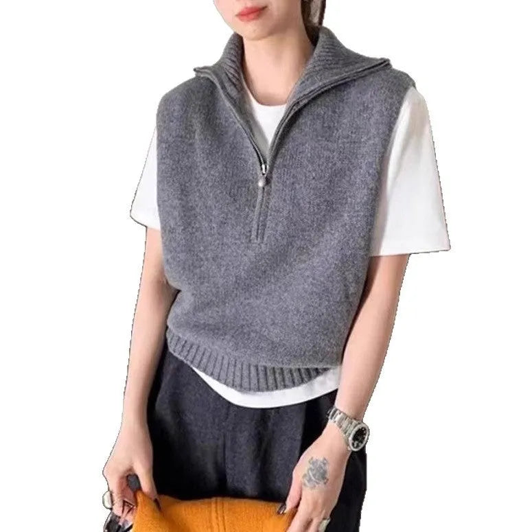 Women's half-zip sleeveless knit vest in mesh fabric with a 3D pattern, shown in orange colour.