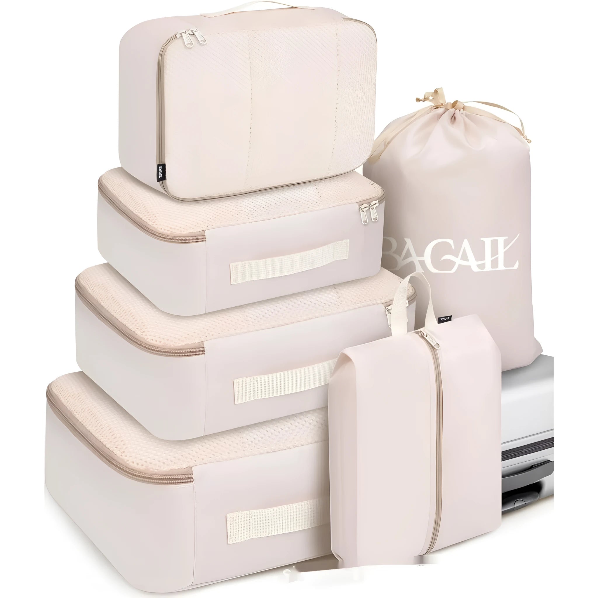 Set of eight cubic-shaped travel packing bags in assorted colours including beige, black, pink, and leopard print patterns.