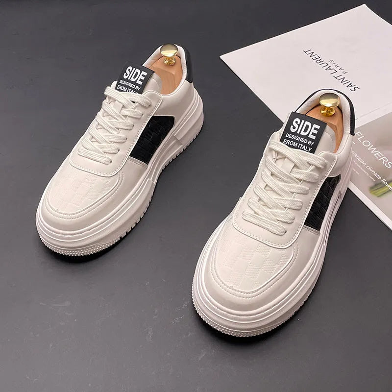White unisex leisure shoes with cloth uppers and rubber foam soles in green or black accent colours