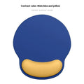 Silicone mouse mat with wristband in a gradient blue colour pattern on a desk.