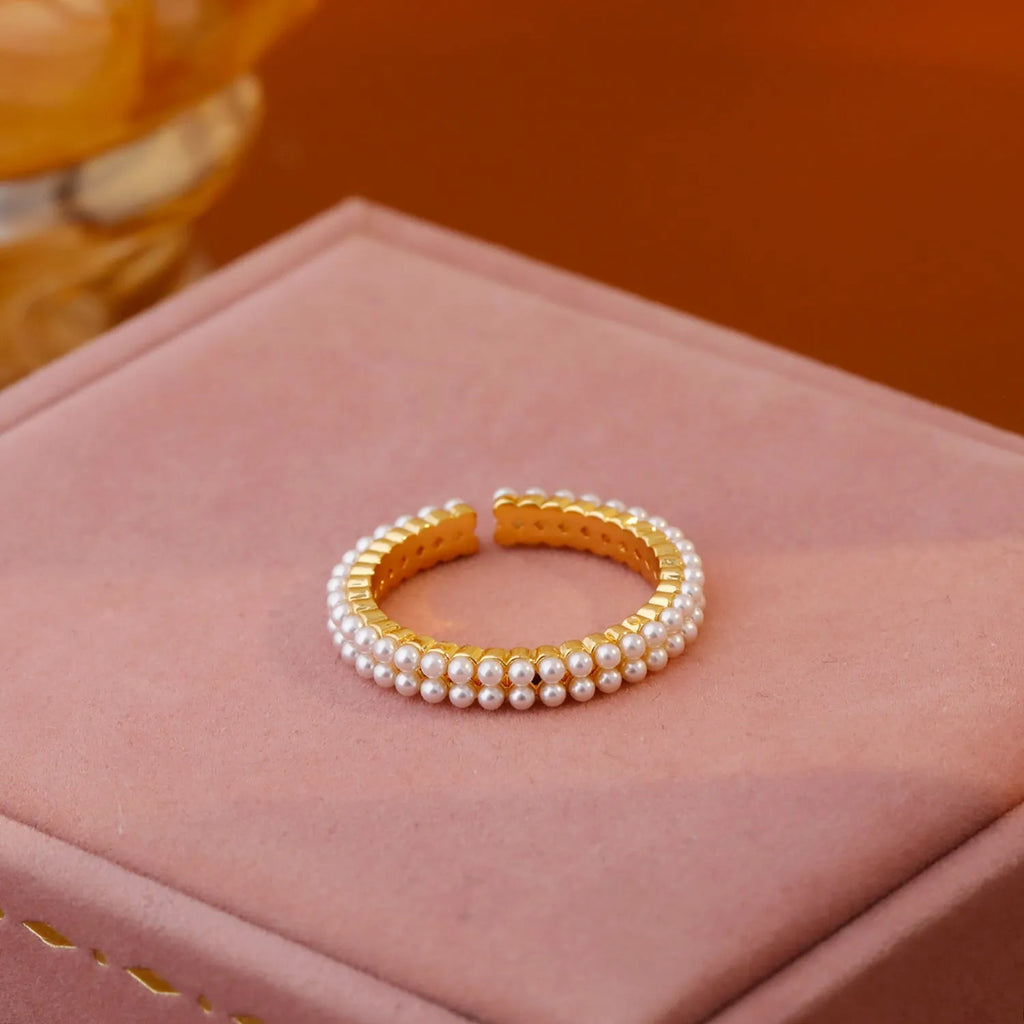 Gold geometric open-mouth women's ring with round pearl detailing on electroplated copper