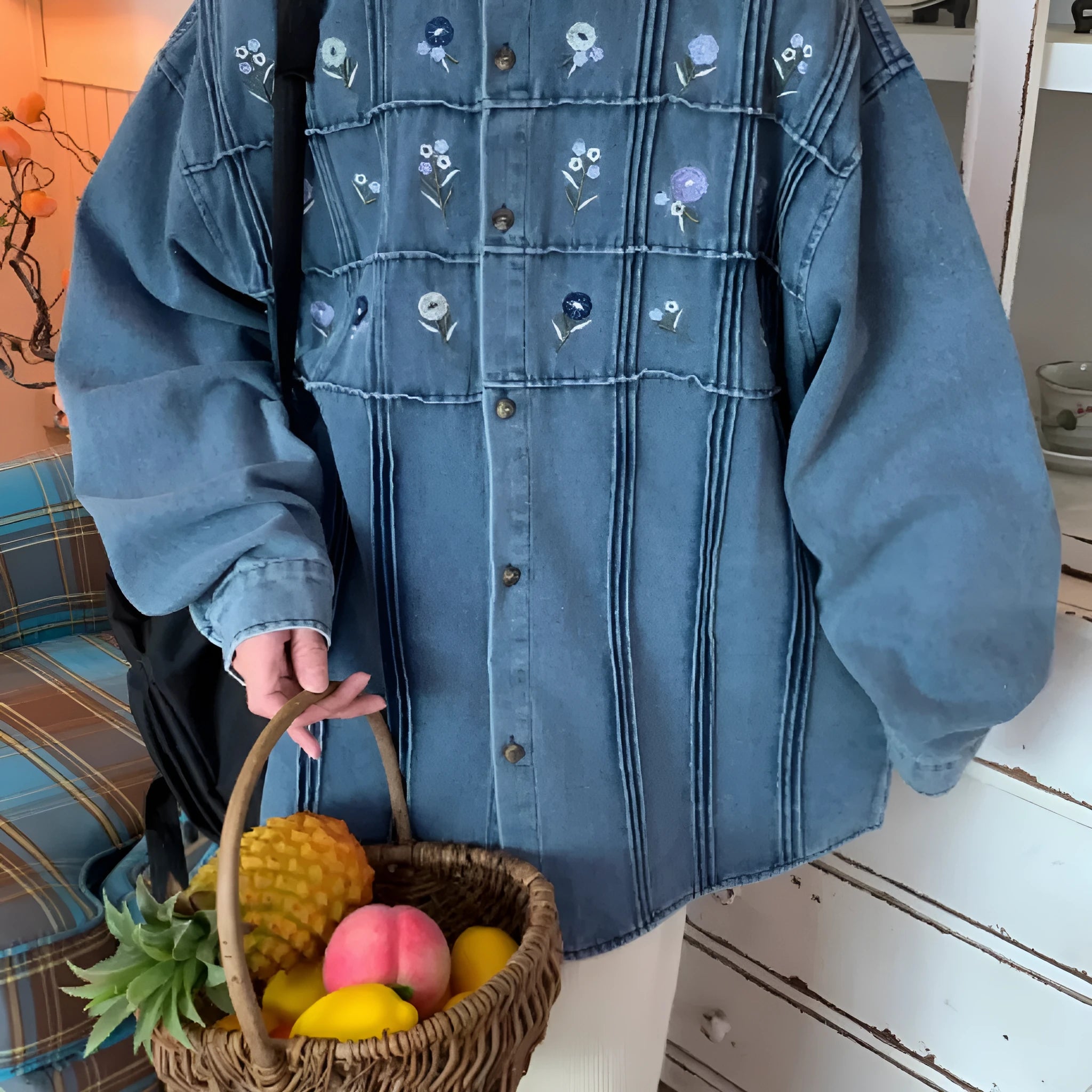 Vintage washed blue denim shirt with small floral print and pleated detail, long sleeves with button front