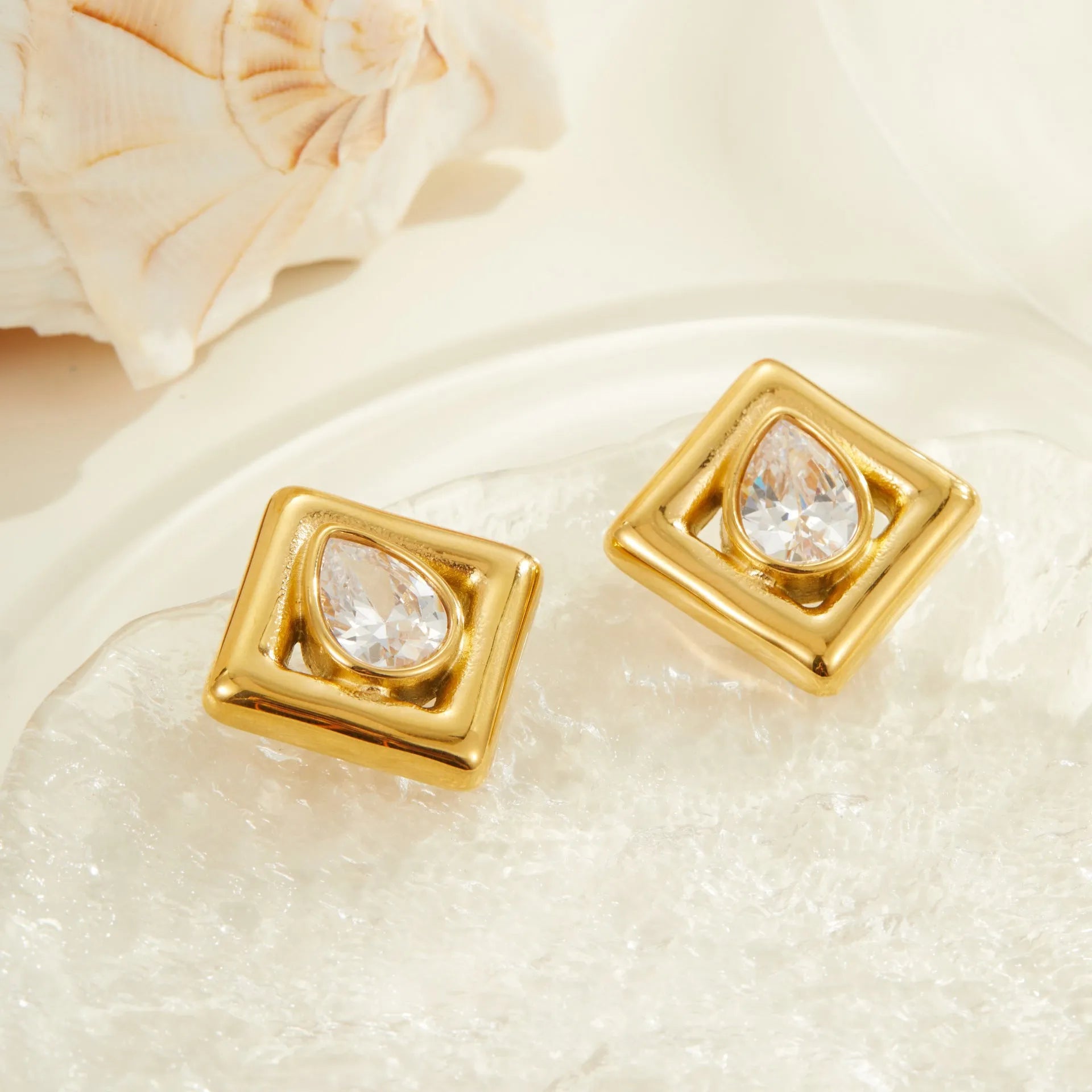 Gold plated geometric stud earrings with water drop zircon inlaid design