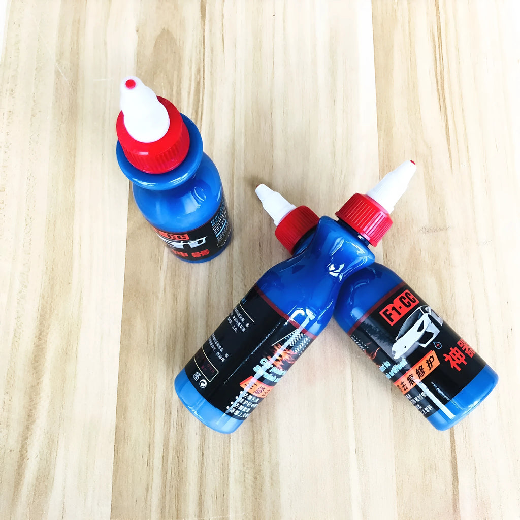 Small blue 10ml automotive scratch repair bottle with integrated applicator brush