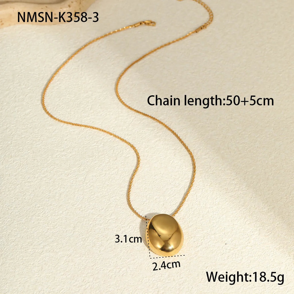 Geometric gold-plated pendant necklace with adjustable chain on white background