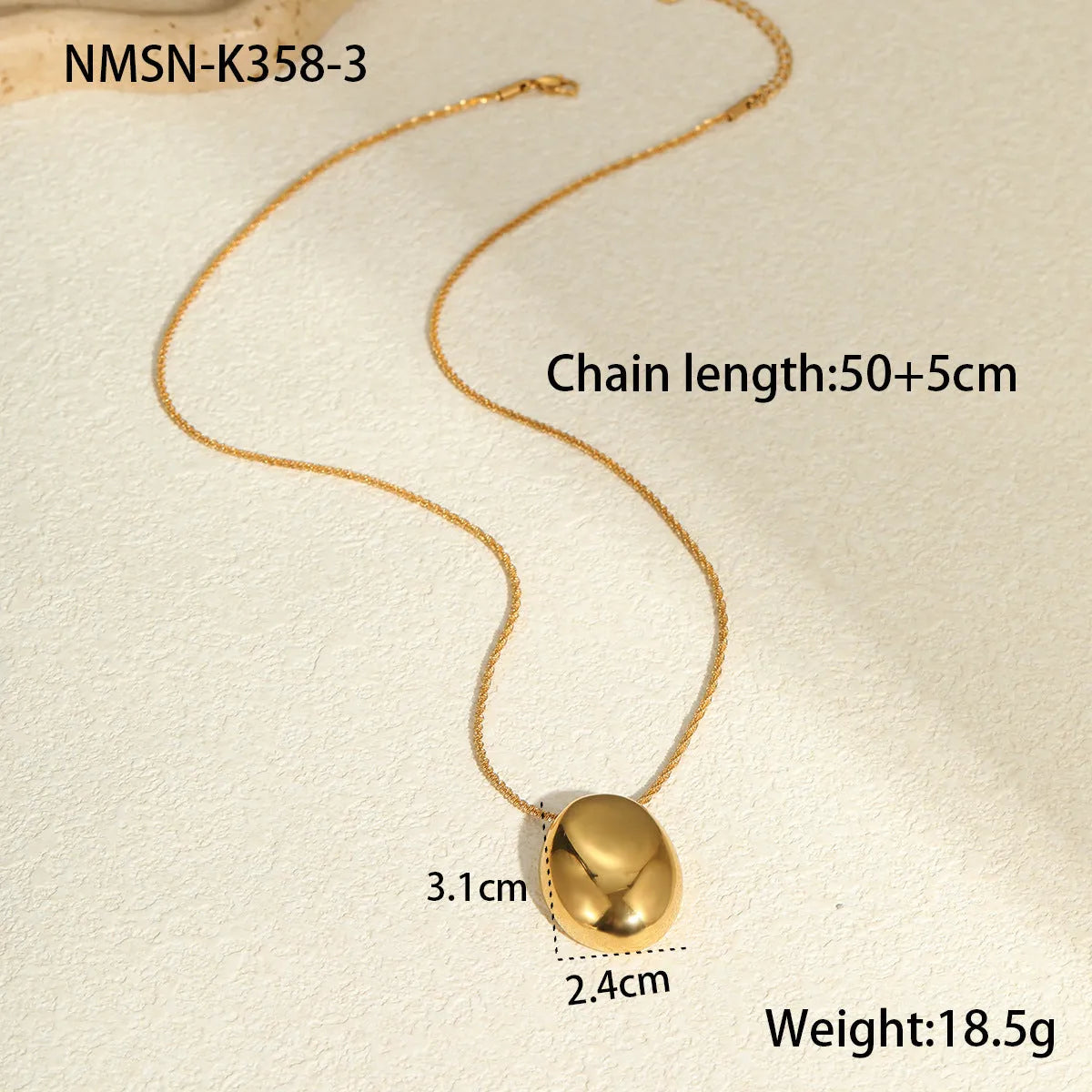 Geometric gold-plated pendant necklace with adjustable chain on white background