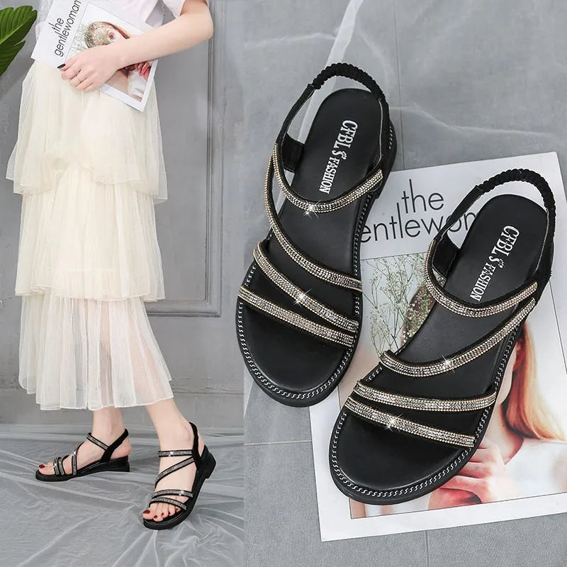 Korean style women's sandals with elastic straps and rhinestone detail in gold colour