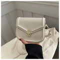Soft black PU messenger bag with clamshell opening and niche texture, shown open.