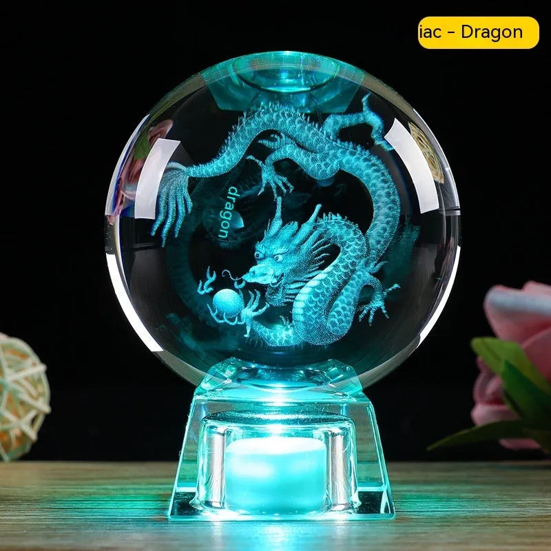 White crystal ball luminous ornament with Chinese zodiac animal design on an electronic charging base.