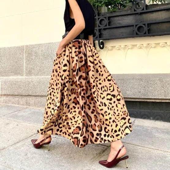 Brown leopard print women's A-line long skirt with a large hemline, shown on a model.