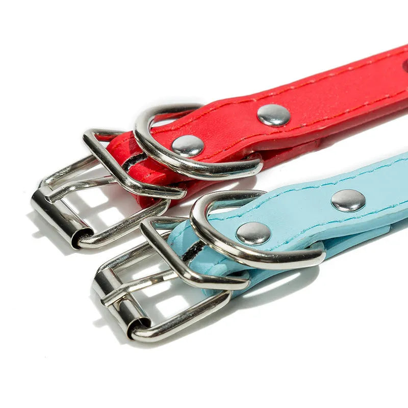 A studded dog collar made of black PU leather with silver metal studs and an alloy buckle fastener.