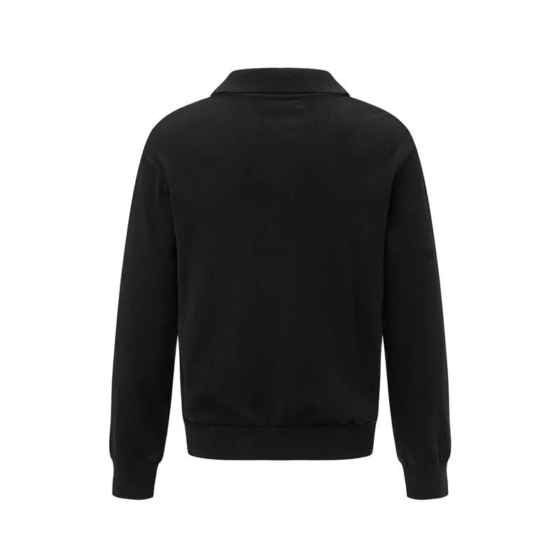 Man wearing a loose black pullover shirt, casual leisure wear.