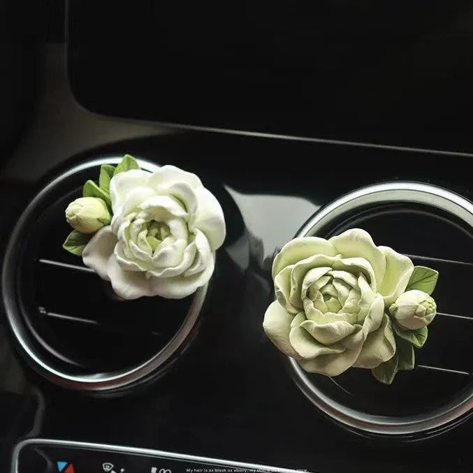 Solid gypsum car vent air freshener in jasmine fragrance, showing off-white or green colour.