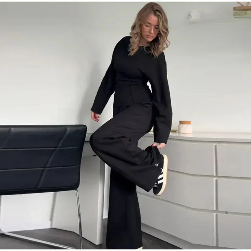 Women's black polar fleece suit set with pleated O-neck long sleeve top and wide leg trousers