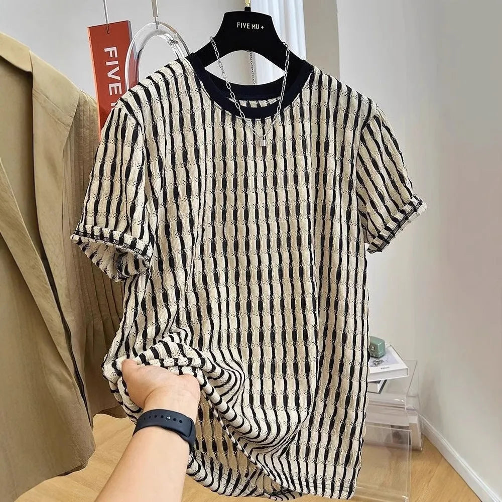 Black and white striped men's short sleeve loose fit pullover shirt on a hanger.