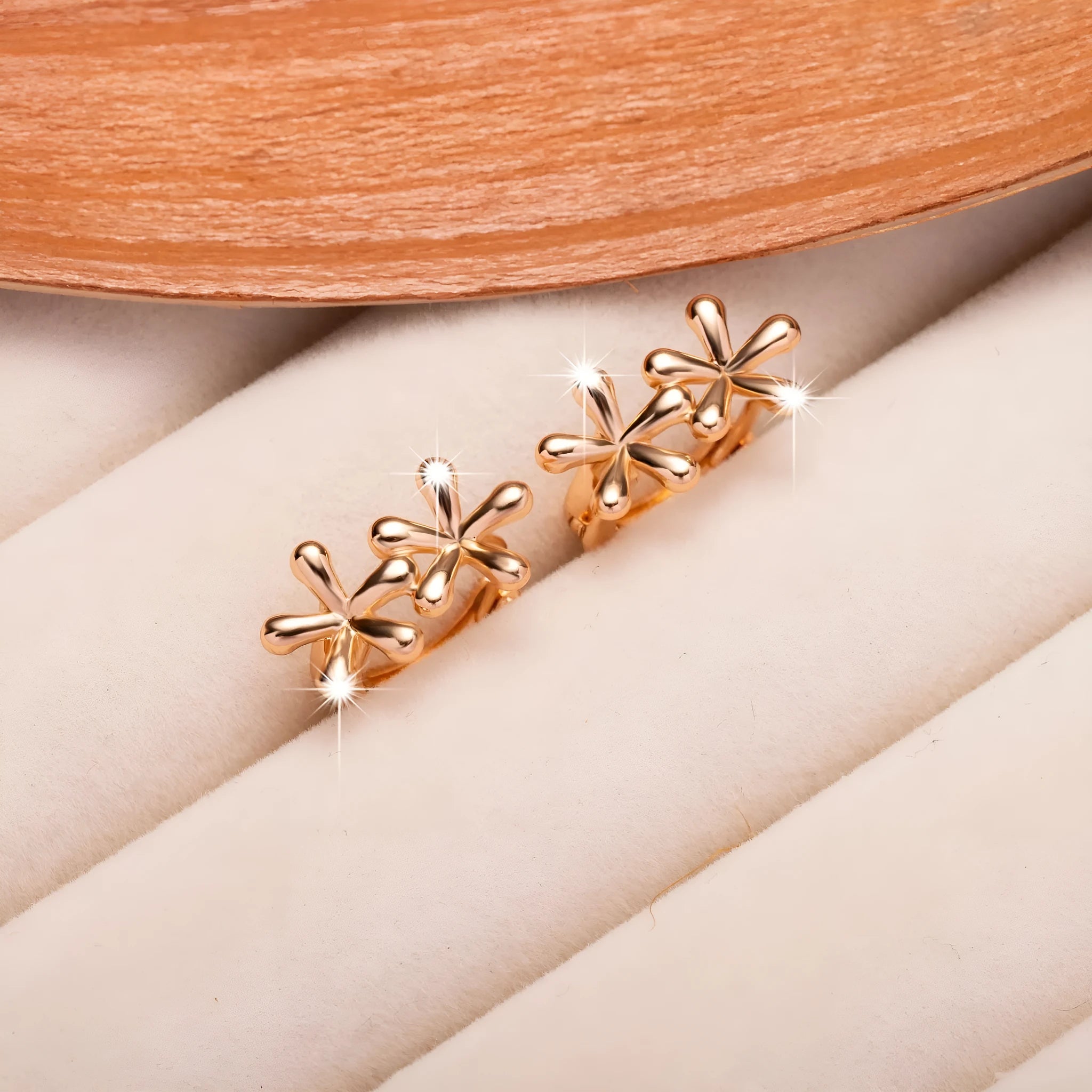 Circular rose gold earrings featuring a waterdrop flower design for women.