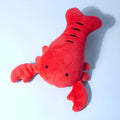 Red lobster-shaped squeaky plush dog toy for small and medium breeds.
