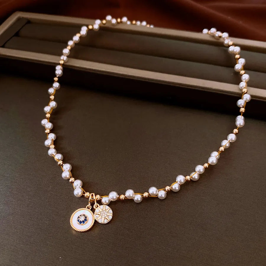 Women's gold electroplated round pendant necklace with zircon and imitation pearl on adjustable clavicle chain