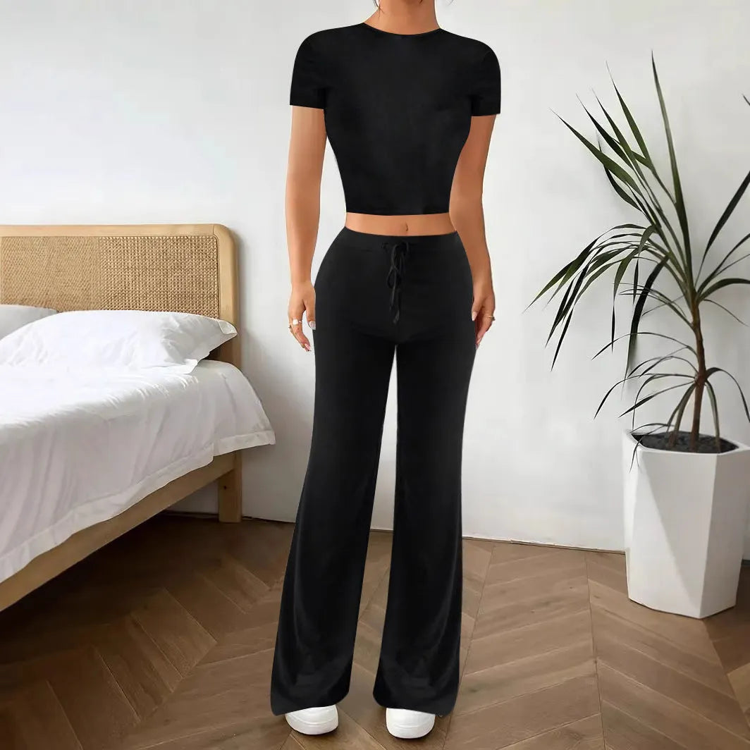Black polyester women's high waist trousers and short sleeve t-shirt suit on hanger