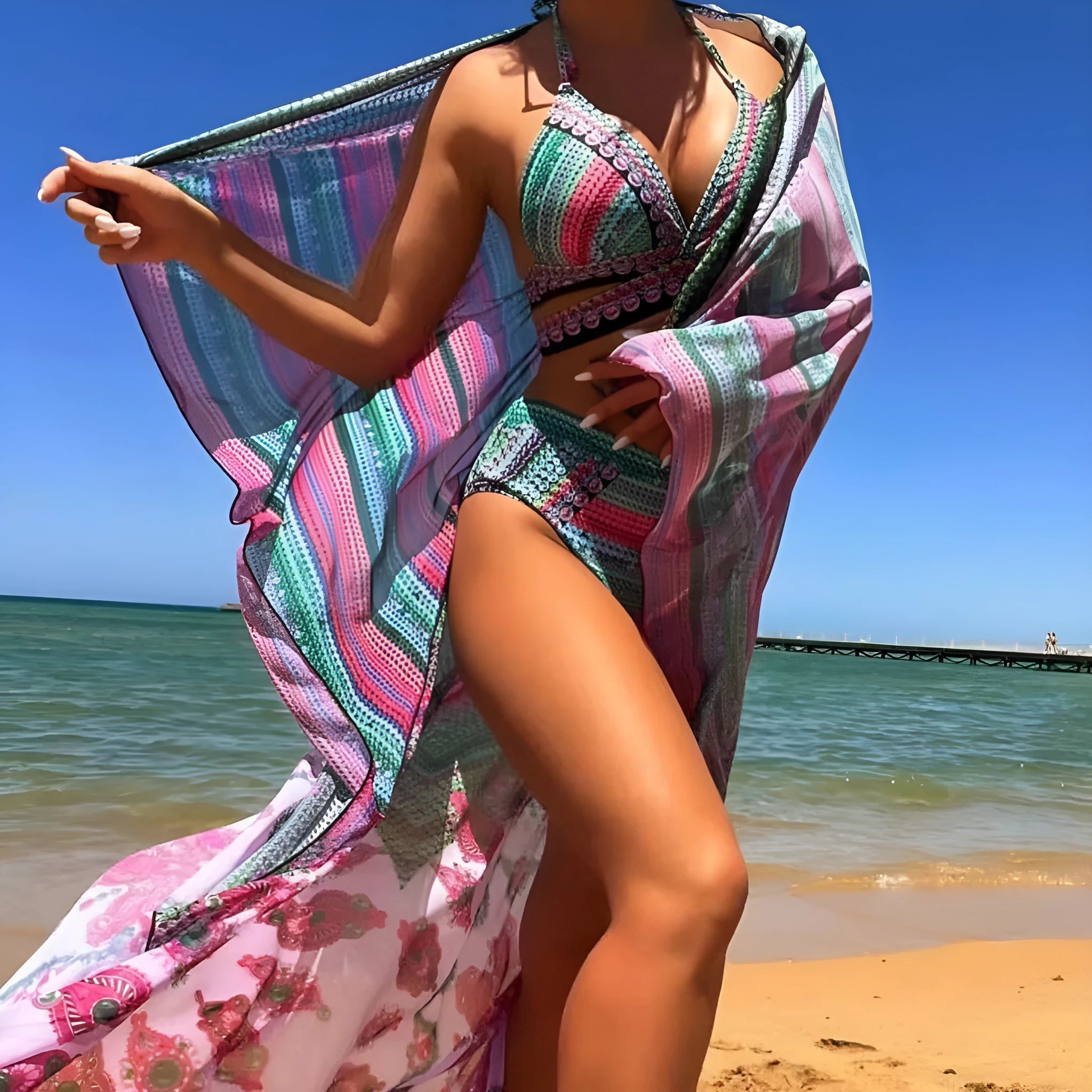Blue women's three-piece bikini swimsuit with cross bandage design and high waist briefs.