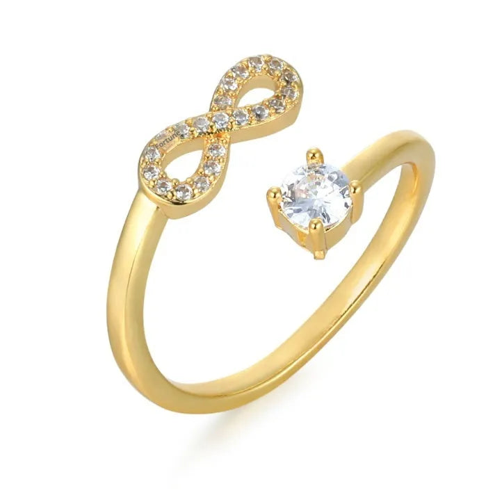 Geometric open band ring featuring a letter 'A' with inlaid zircon stones, shown in a rose gold finish.